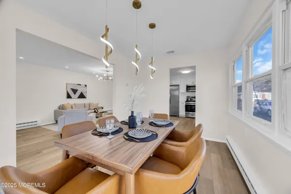 a kitchen with stainless steel appliances granite countertop a refrigerator a stove top oven a sink and dishwasher