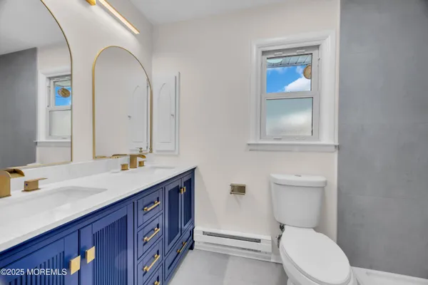 a bathroom with a sink and toilet