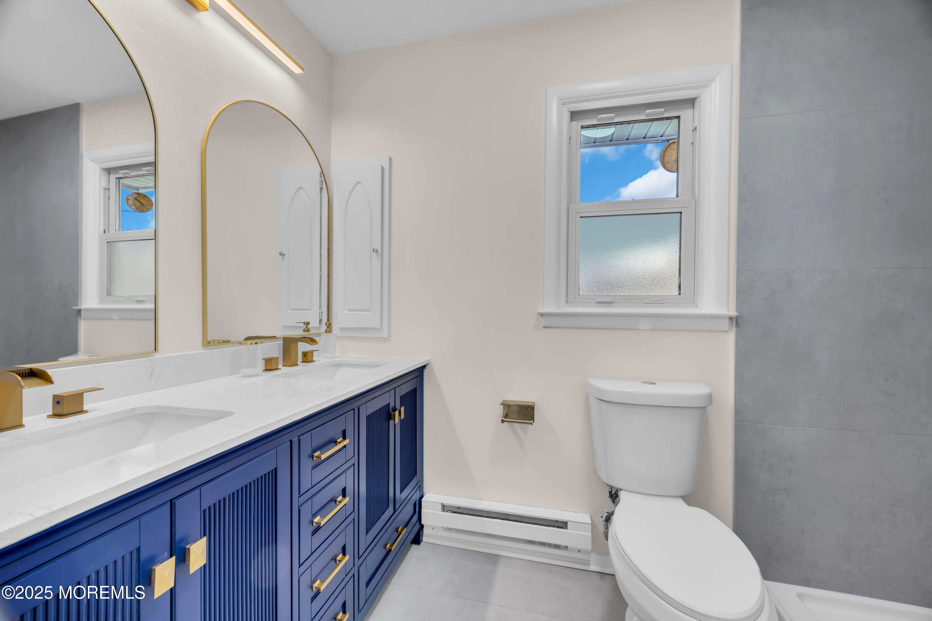 37 Central Boulevard Brick, NJ 08724 - Photo 16 of 32 a bathroom with a granite countertop toilet sink and mirror