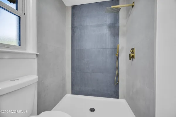 a bathroom with a sink and toilet
