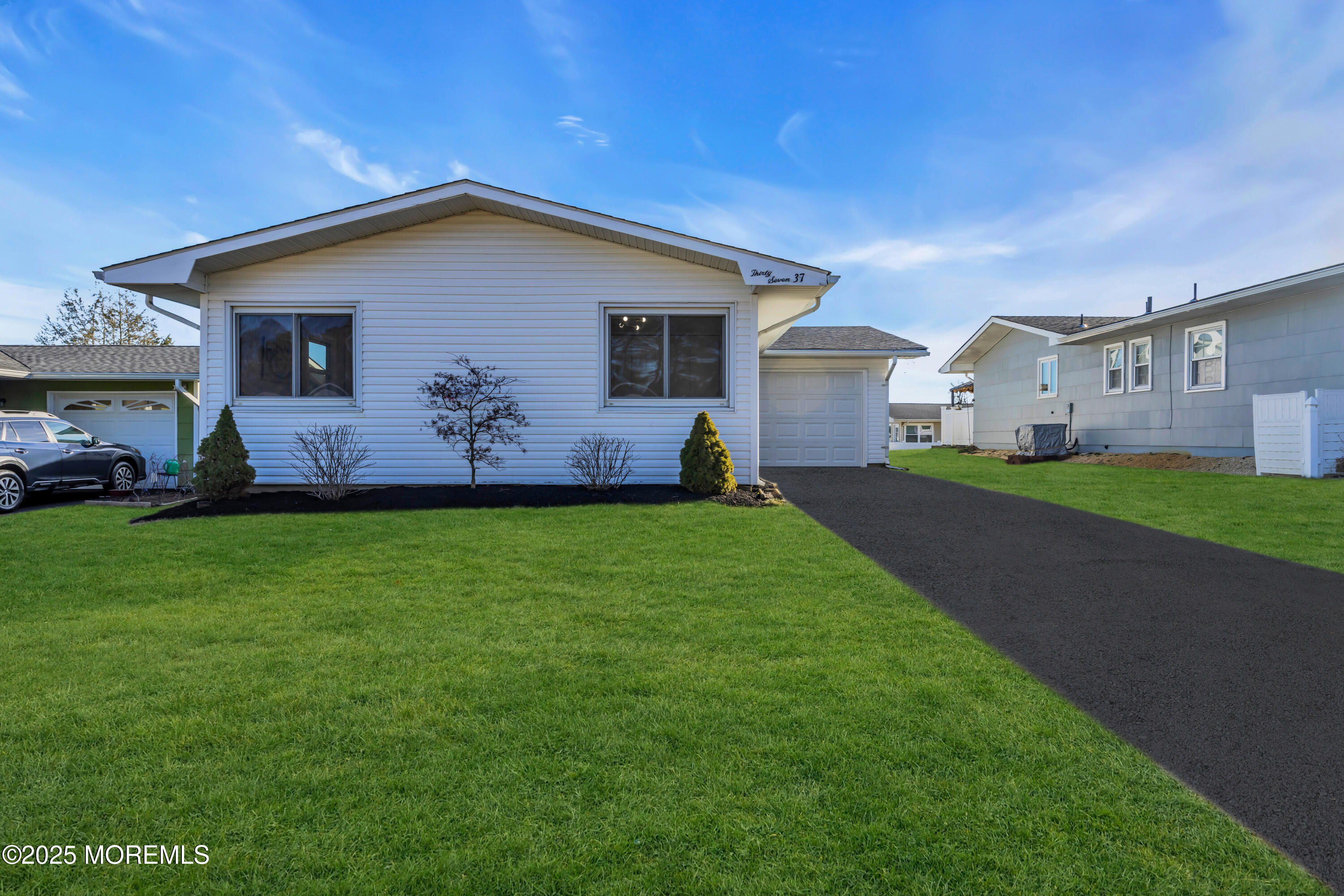 37 Central Boulevard Brick, NJ 08724 - Photo 2 of 32 a front view of house with yard and green space