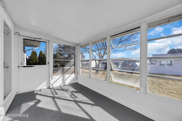 a view of livingroom with furniture and windows