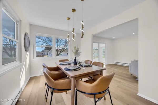a dining room with furniture and window