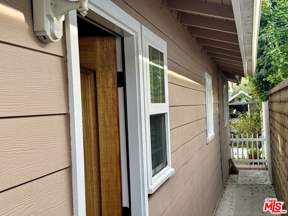 a view of a door and a window