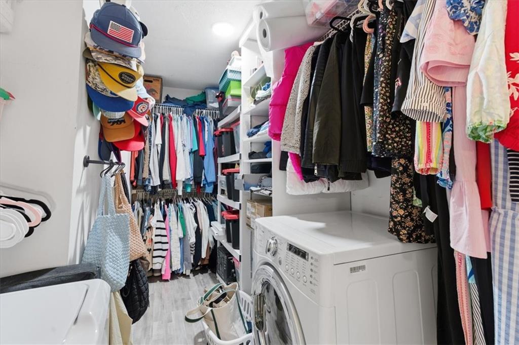 6851 Roswell Road, Unit J14 Sandy Springs, GA 30328 - Photo 17 of 41 a view of walk in closet with clothes