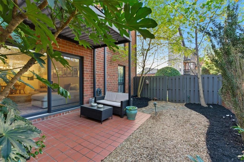 6851 Roswell Road, Unit J14 Sandy Springs, GA 30328 - Photo 19 of 41 a view of backyard with tree