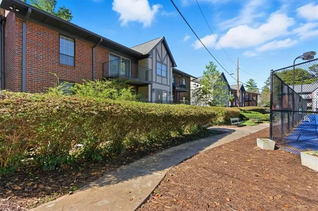 a view of a pathway in front of house