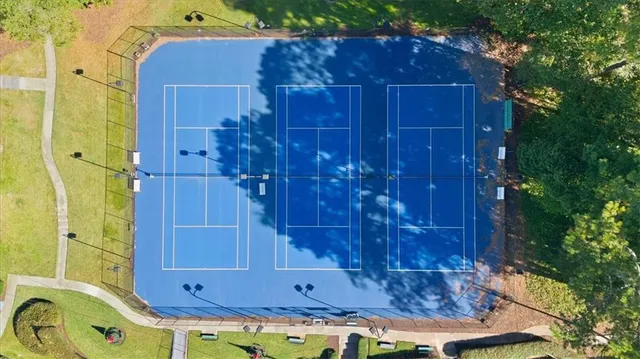 an aerial view of residential houses with outdoor space