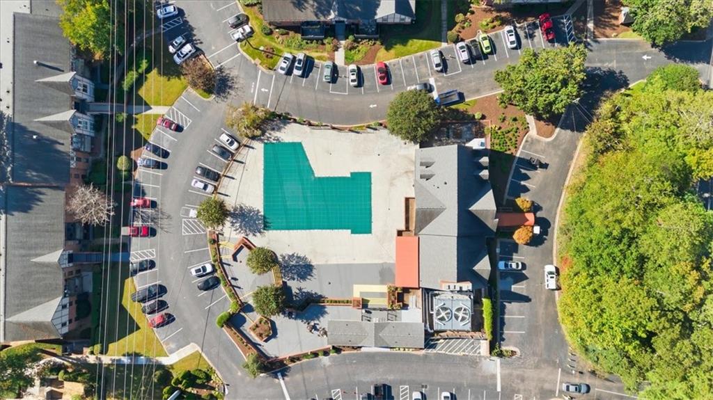 6851 Roswell Road, Unit J14 Sandy Springs, GA 30328 - Photo 30 of 41 an aerial view of residential houses with outdoor space