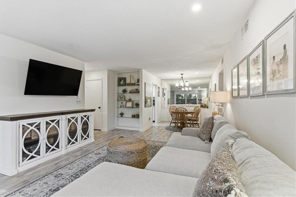 6851 Roswell Road, Unit J14 Sandy Springs, GA 30328 - Photo 3 of 41 a living room with furniture