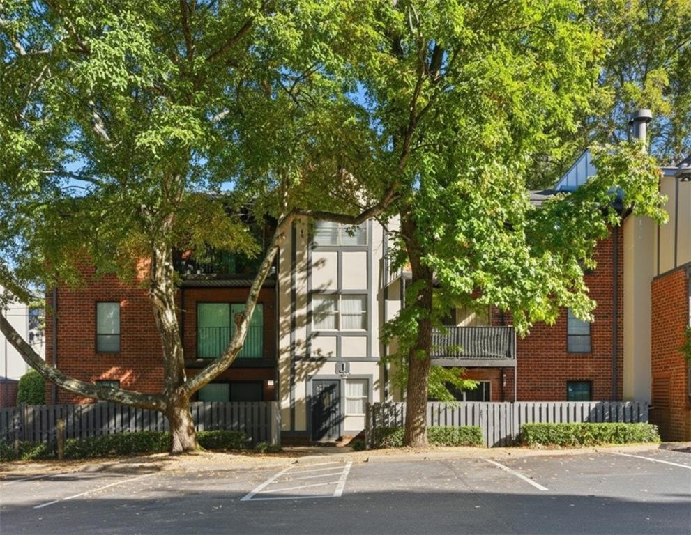 6851 Roswell Road, Unit J14 Sandy Springs, GA 30328 - Photo 37 of 41 an outdoor view of a house