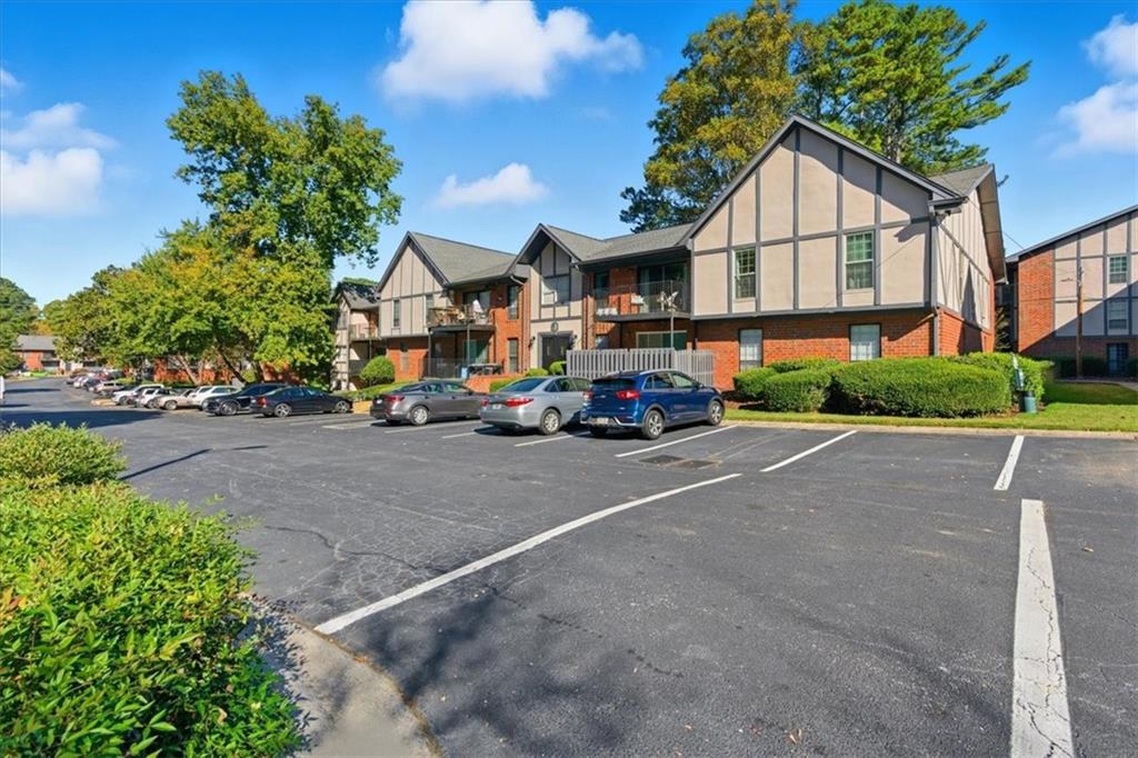 6851 Roswell Road, Unit J14 Sandy Springs, GA 30328 - Photo 40 of 41 a car parked in front of a house