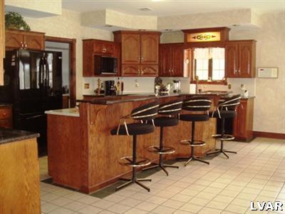 895 Gove Road Nazareth, PA 18064 - Photo 16 of 66 a kitchen with a sink a counter top space cabinets and stainless steel appliances