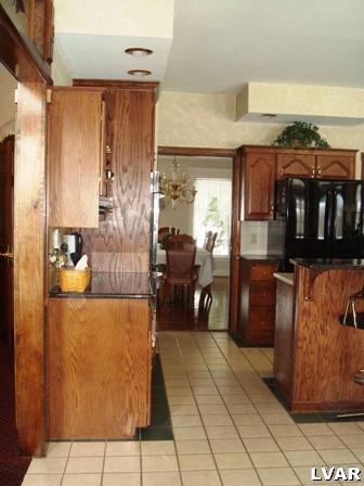 895 Gove Road Nazareth, PA 18064 - Photo 18 of 66 a kitchen with stainless steel appliances granite countertop a refrigerator and a stove