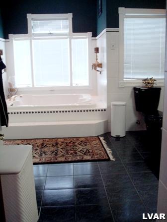 895 Gove Road Nazareth, PA 18064 - Photo 36 of 66 a bathroom with a bathtub and a window