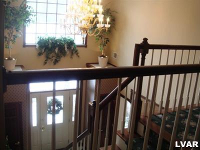 895 Gove Road Nazareth, PA 18064 - Photo 51 of 66 a view of staircase with railing and a chandelier