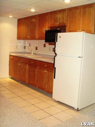895 Gove Road Nazareth, PA 18064 - Photo 58 of 66 a kitchen with a sink and a refrigerator