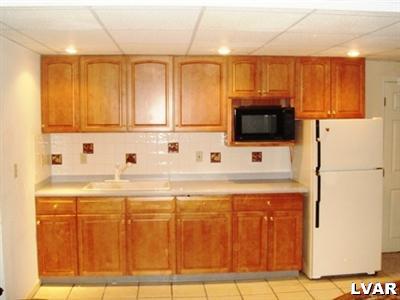 895 Gove Road Nazareth, PA 18064 - Photo 59 of 66 a kitchen with stainless steel appliances granite countertop a refrigerator a stove a sink and a white cabinets