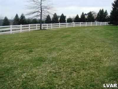895 Gove Road Nazareth, PA 18064 - Photo 8 of 66 a view of a green field with wooden fence