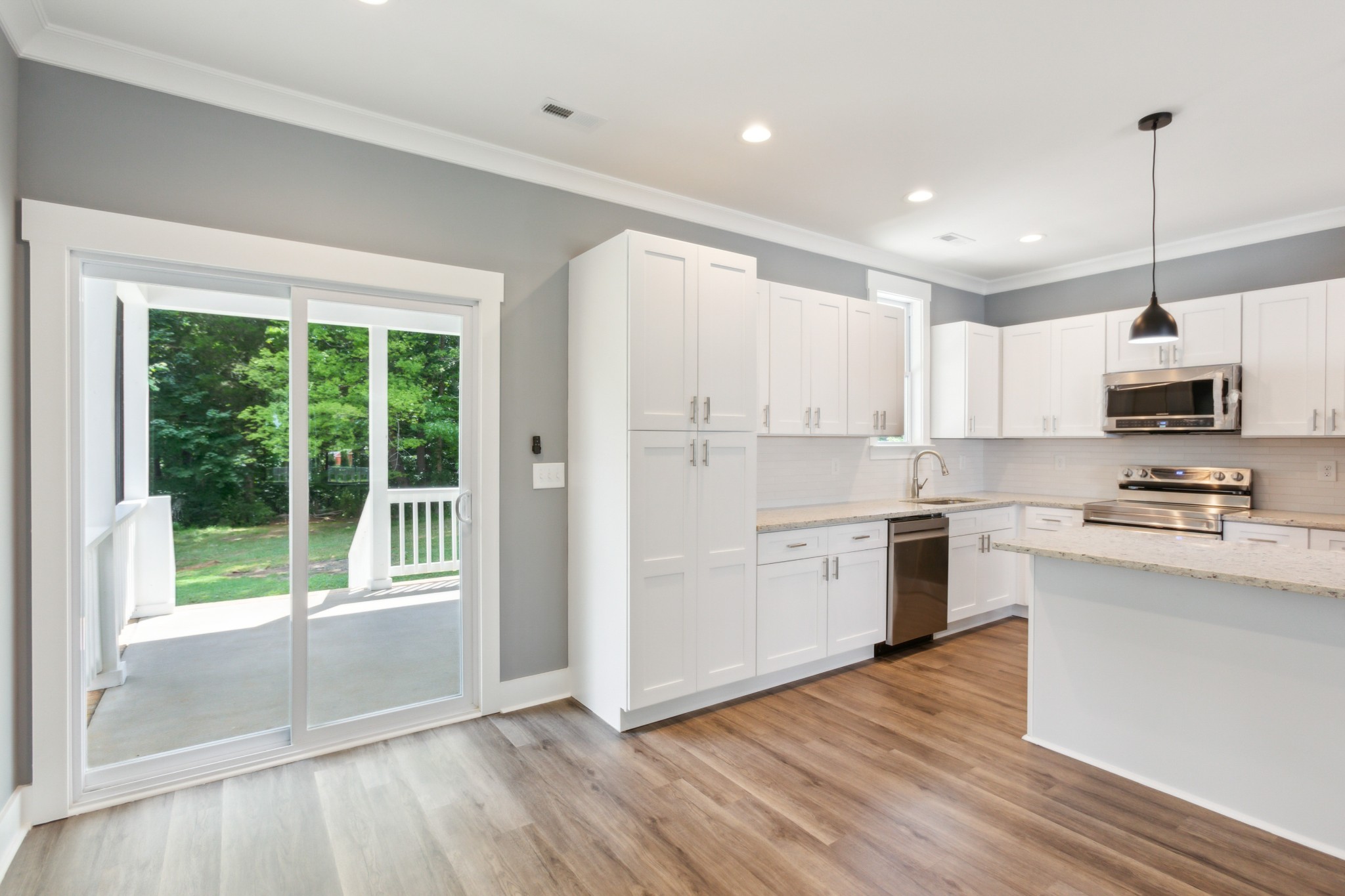 618 Scattersville Road Portland, TN 37148 - Photo 5 of 18 a kitchen with stainless steel appliances granite countertop a stove a sink and a refrigerator