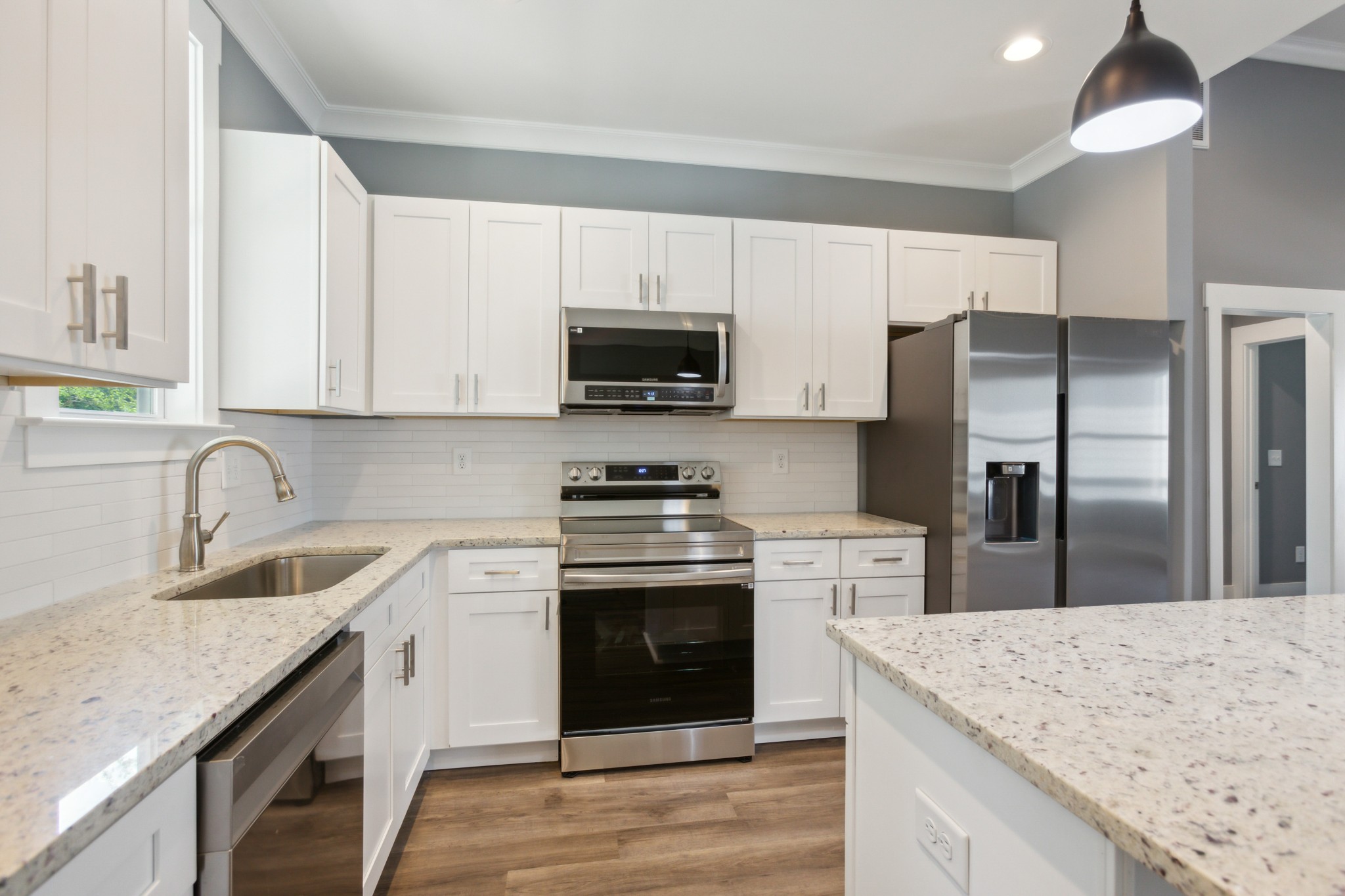 618 Scattersville Road Portland, TN 37148 - Photo 6 of 18 a kitchen with stainless steel appliances granite countertop a sink stove and refrigerator