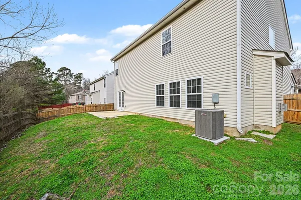 a backyard of a house with lots of green space