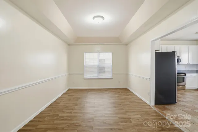 a view of a livingroom with wooden floor