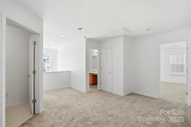 a view of a livingroom with a ceiling fan and window