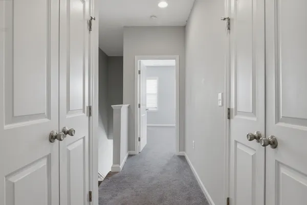 a view of a hallway with a closet