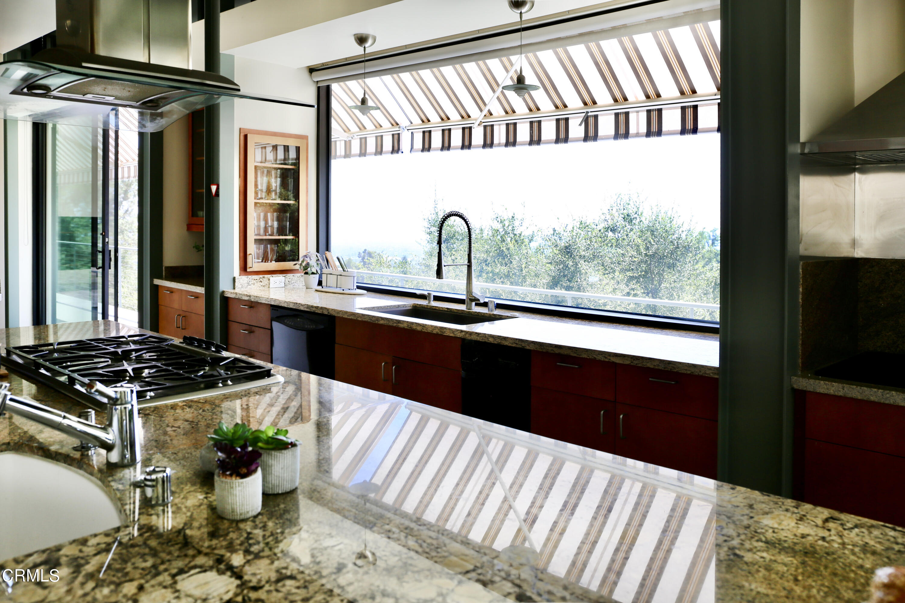 3555 Shaw Ranch Road Pasadena, CA 91107 - Photo 14 of 45 a kitchen with a sink a stove and a window