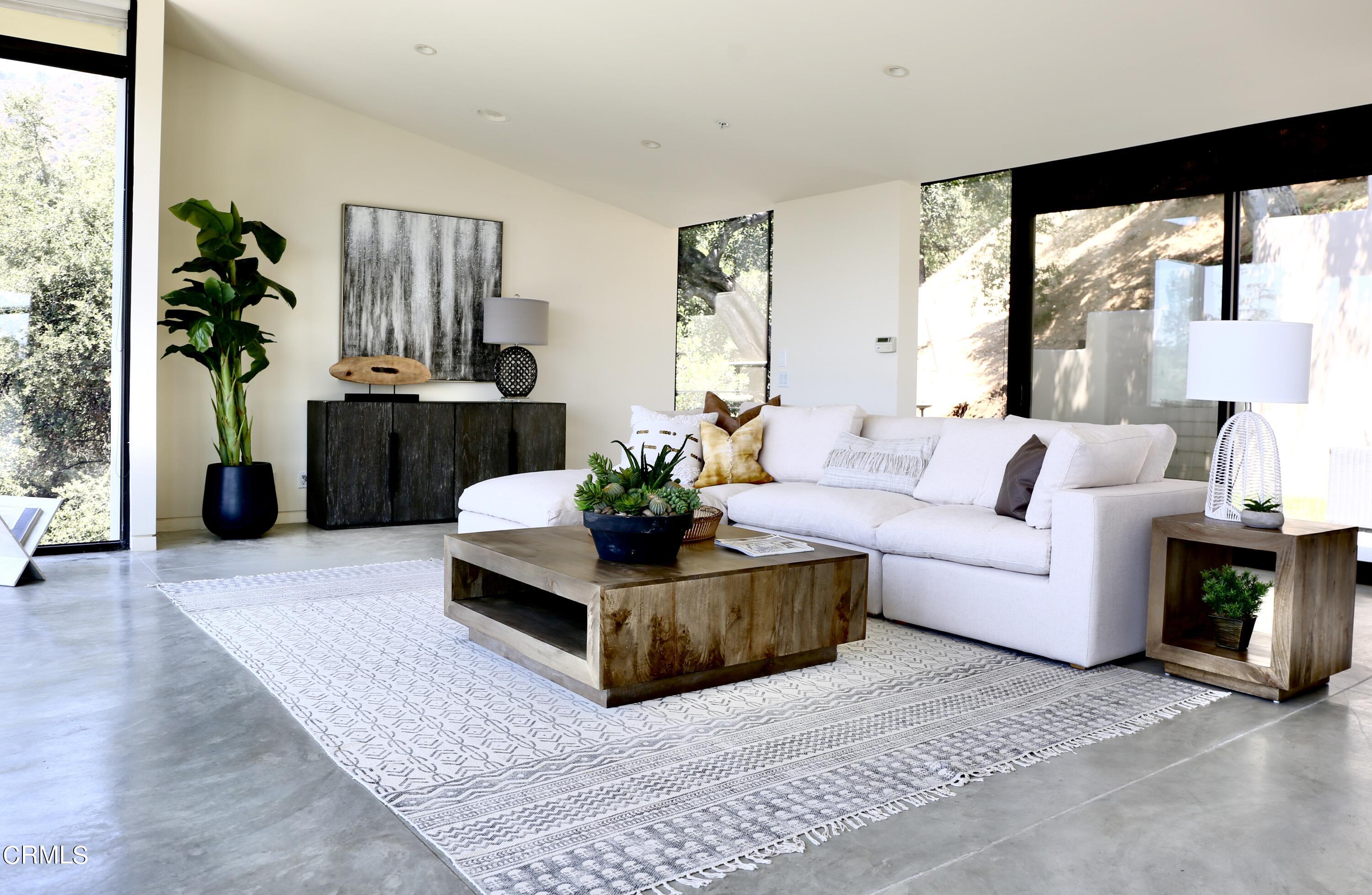 3555 Shaw Ranch Road Pasadena, CA 91107 - Photo 18 of 45 a living room with furniture fireplace and a large window
