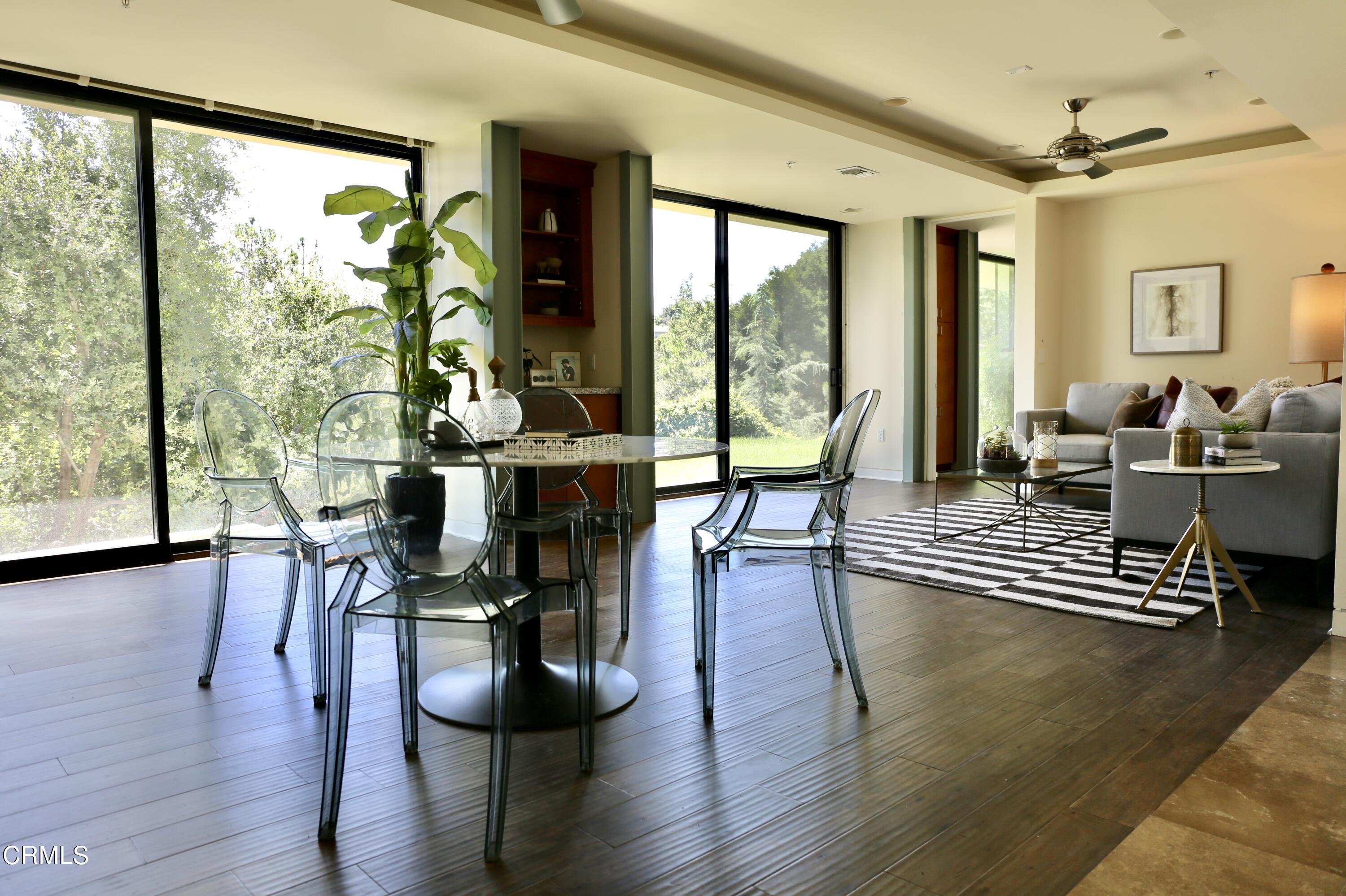 3555 Shaw Ranch Road Pasadena, CA 91107 - Photo 24 of 45 a living room with furniture and a large window with wooden floor