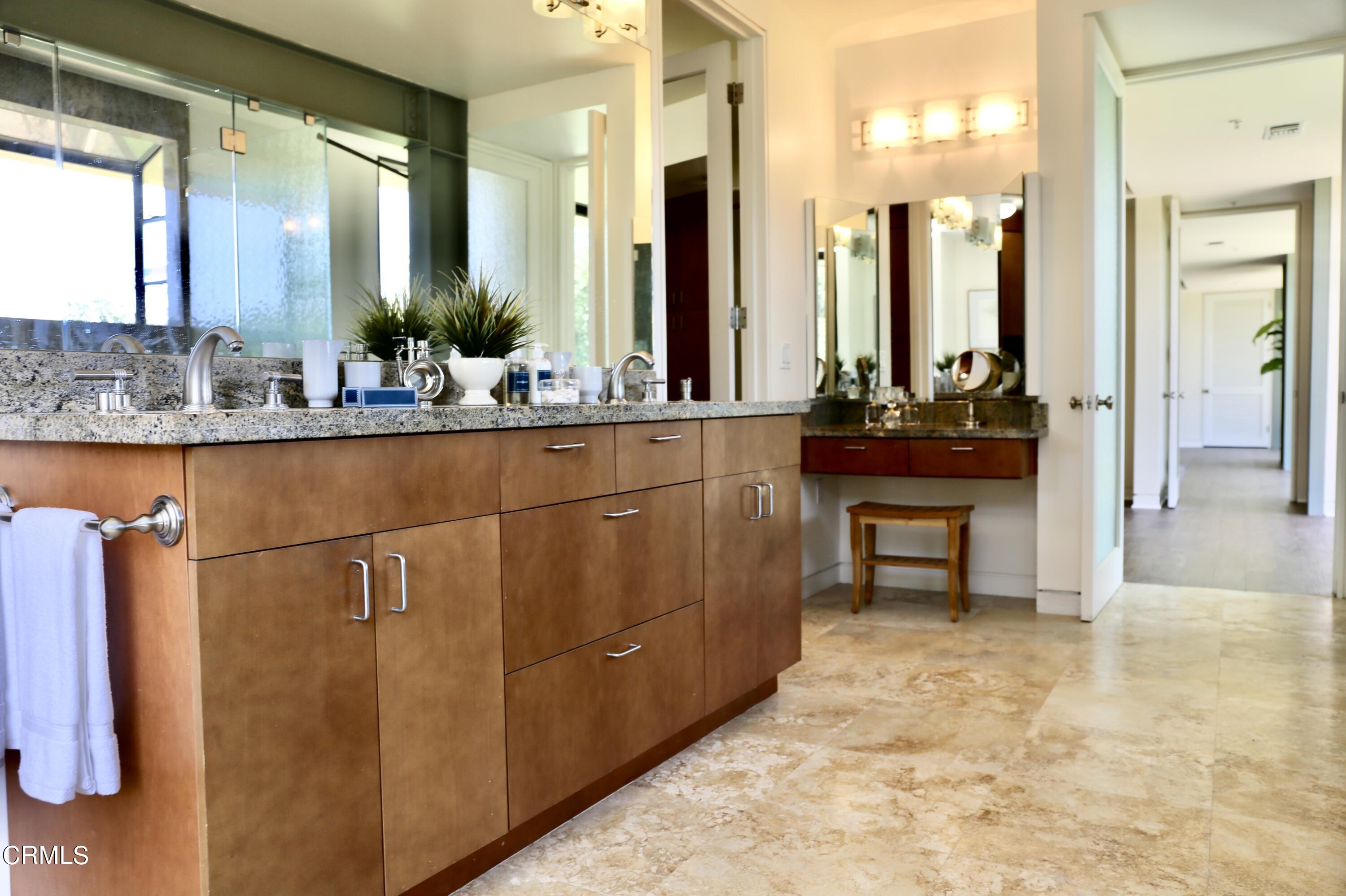 3555 Shaw Ranch Road Pasadena, CA 91107 - Photo 29 of 45 a bathroom with a sink and a mirror