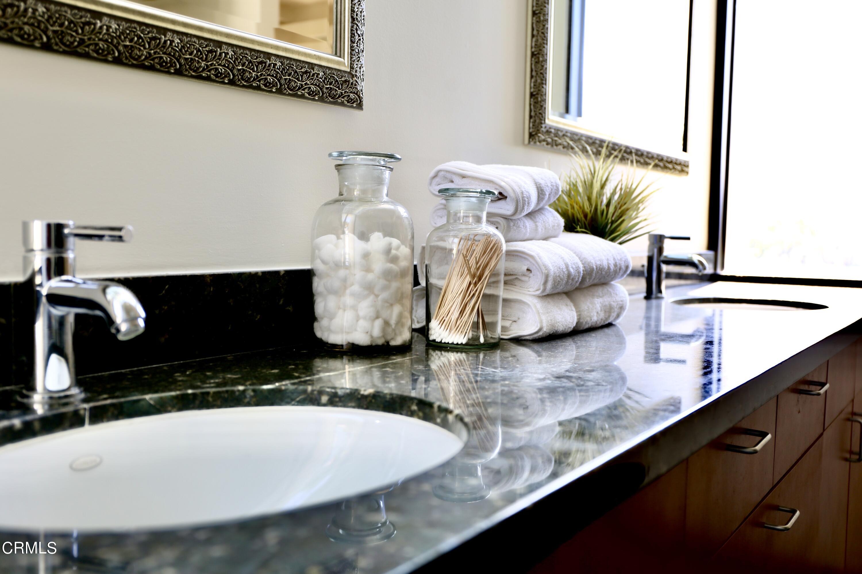 3555 Shaw Ranch Road Pasadena, CA 91107 - Photo 35 of 45 a bathroom with a double vanity sink and a mirror