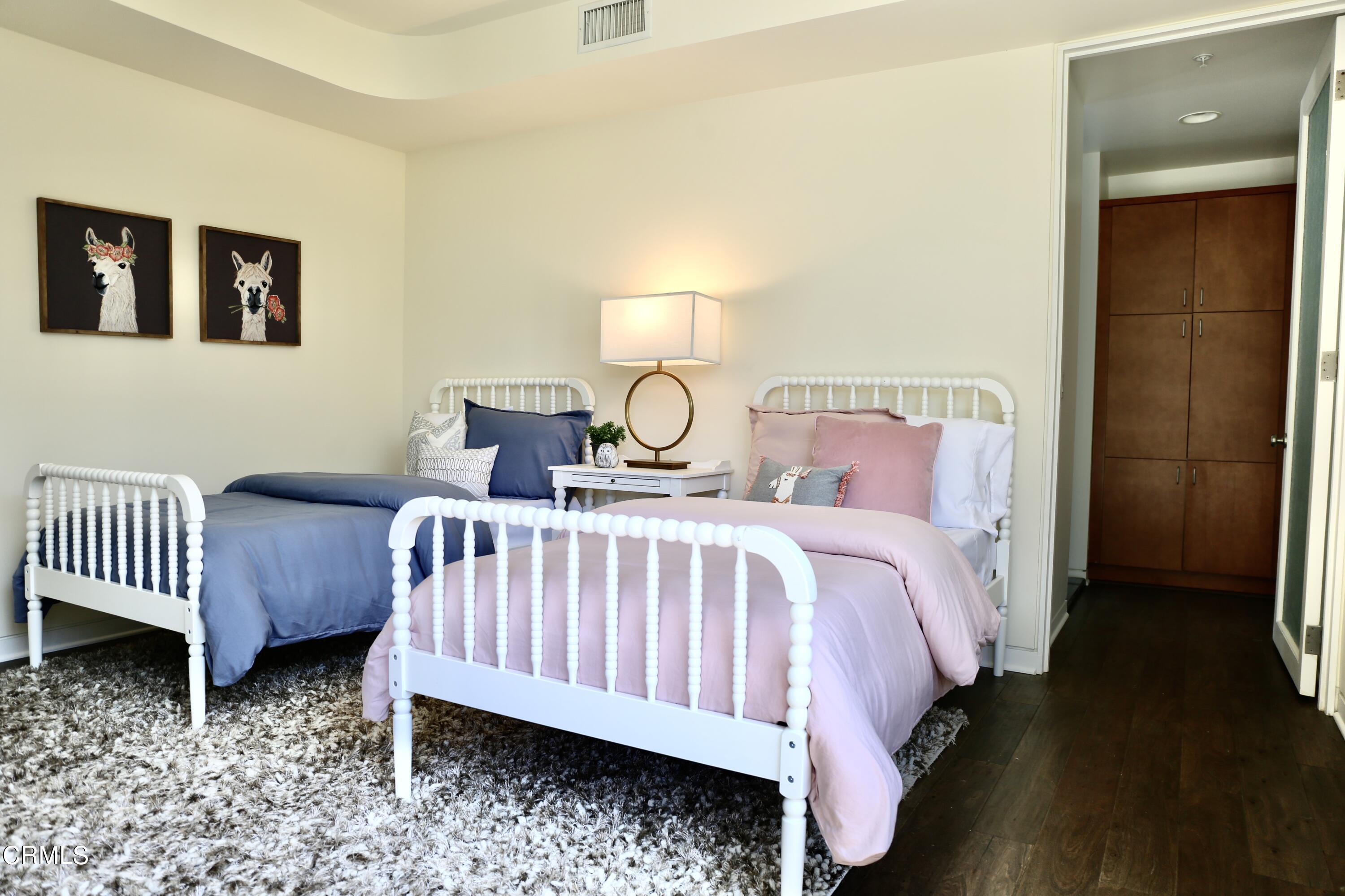 3555 Shaw Ranch Road Pasadena, CA 91107 - Photo 36 of 45 a bed room with a bed and a lamp