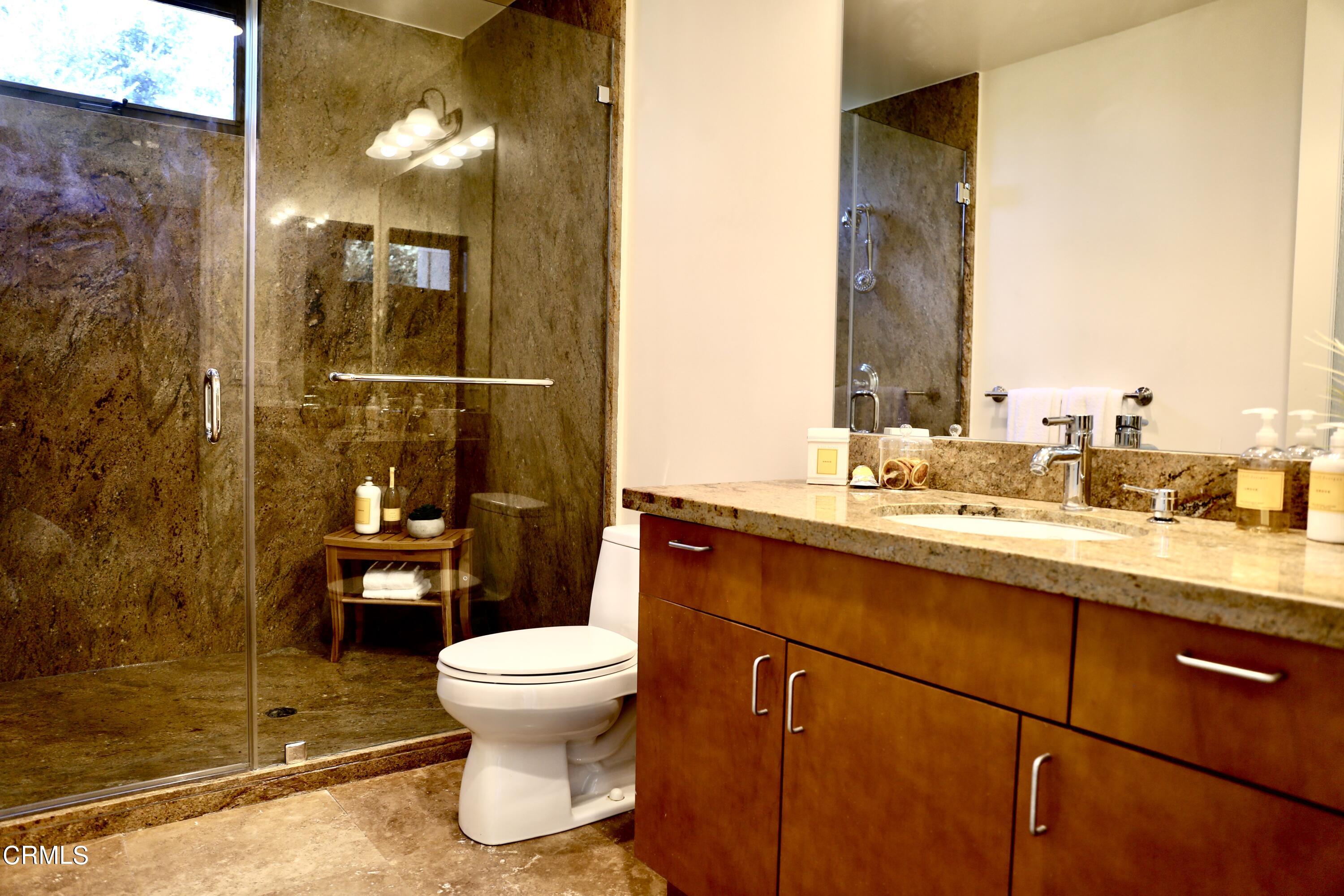 3555 Shaw Ranch Road Pasadena, CA 91107 - Photo 37 of 45 a bathroom with a sink a toilet and shower