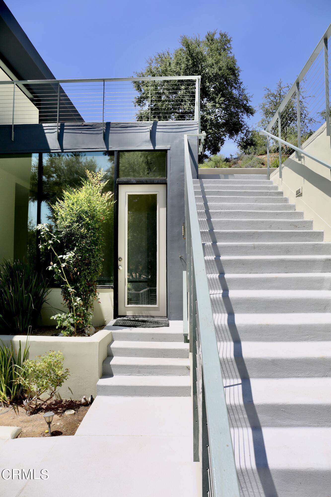 3555 Shaw Ranch Road Pasadena, CA 91107 - Photo 38 of 45 a front view of a house with a garden