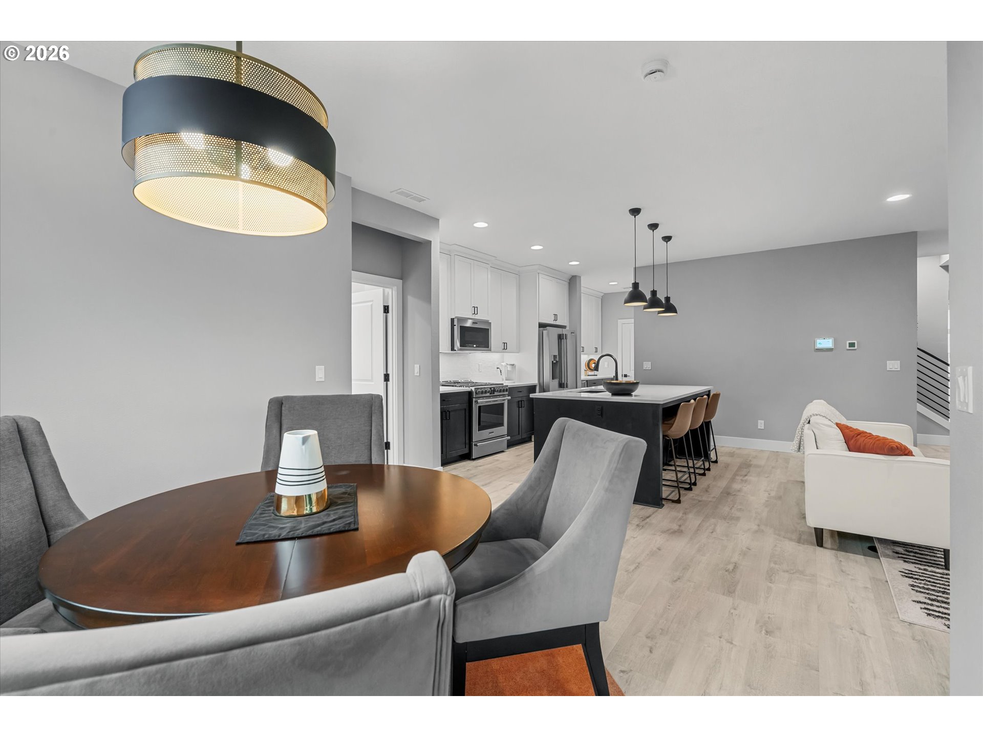 723 Southwest 49th Street Gresham, OR 97080 - Photo 11 of 48 a dining room with furniture and a chandelier