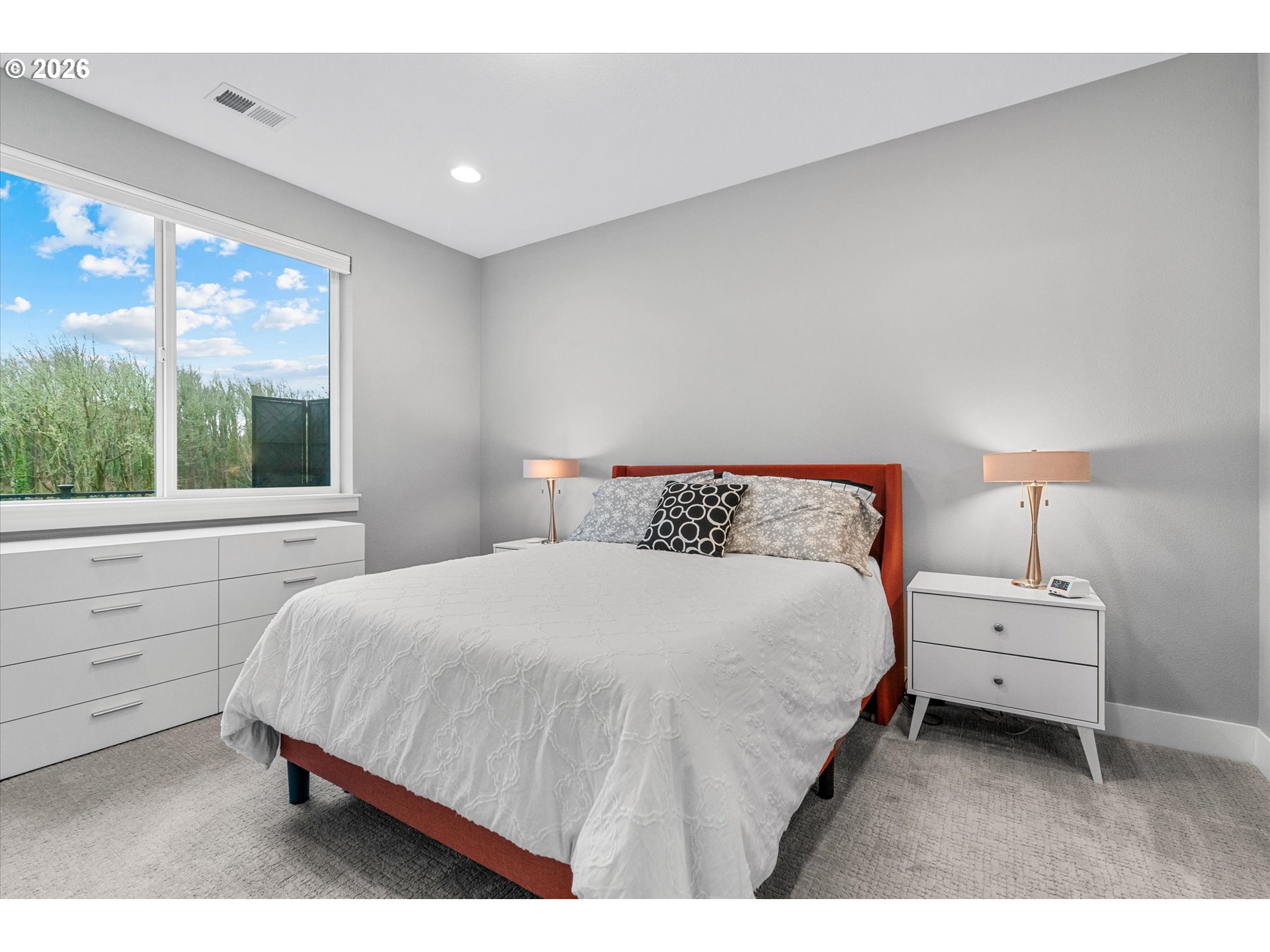 723 Southwest 49th Street Gresham, OR 97080 - Photo 19 of 48 a bedroom with a bed a large window with double vanity