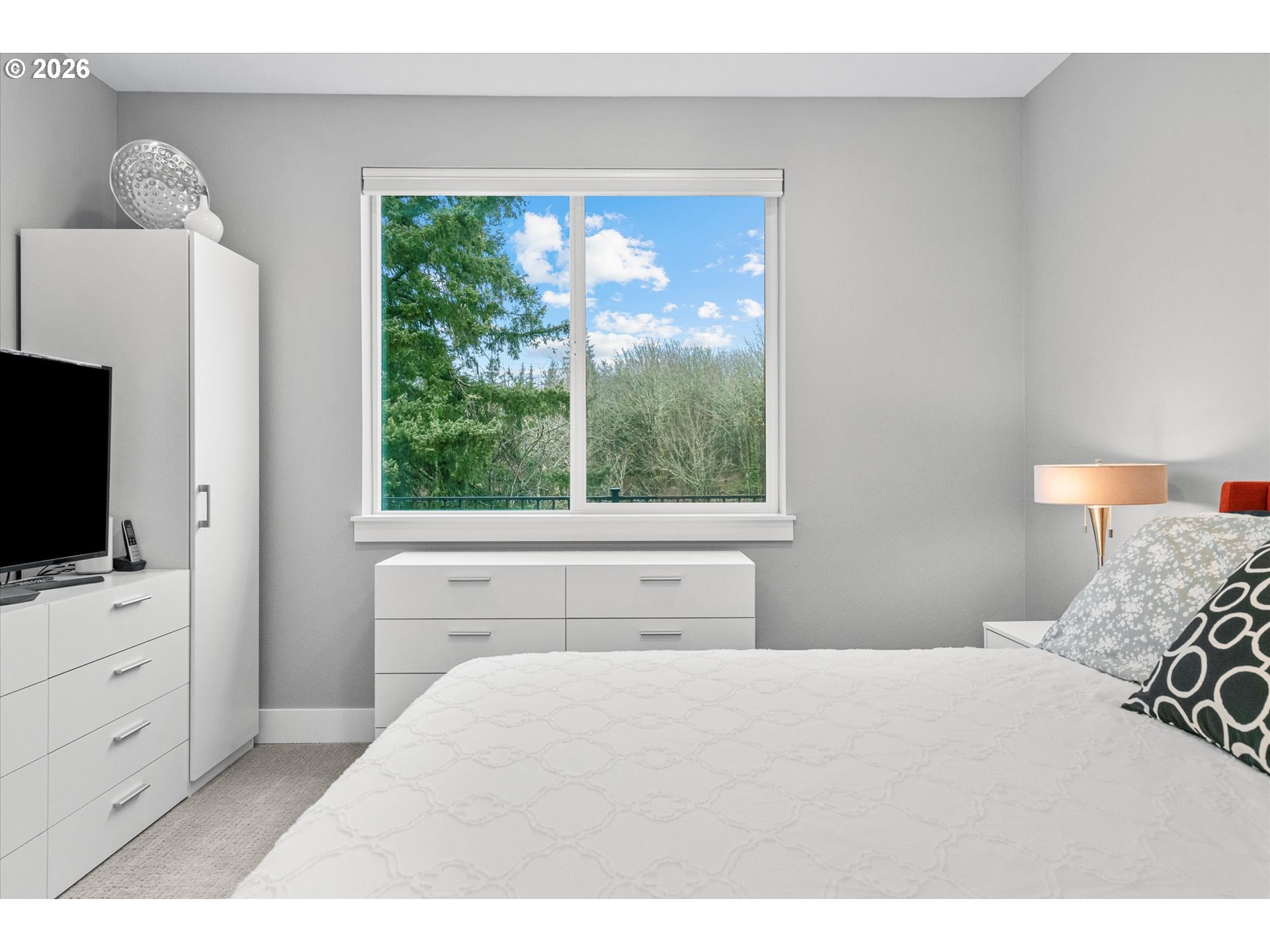 723 Southwest 49th Street Gresham, OR 97080 - Photo 20 of 48 a bedroom with a bed and a flat screen tv