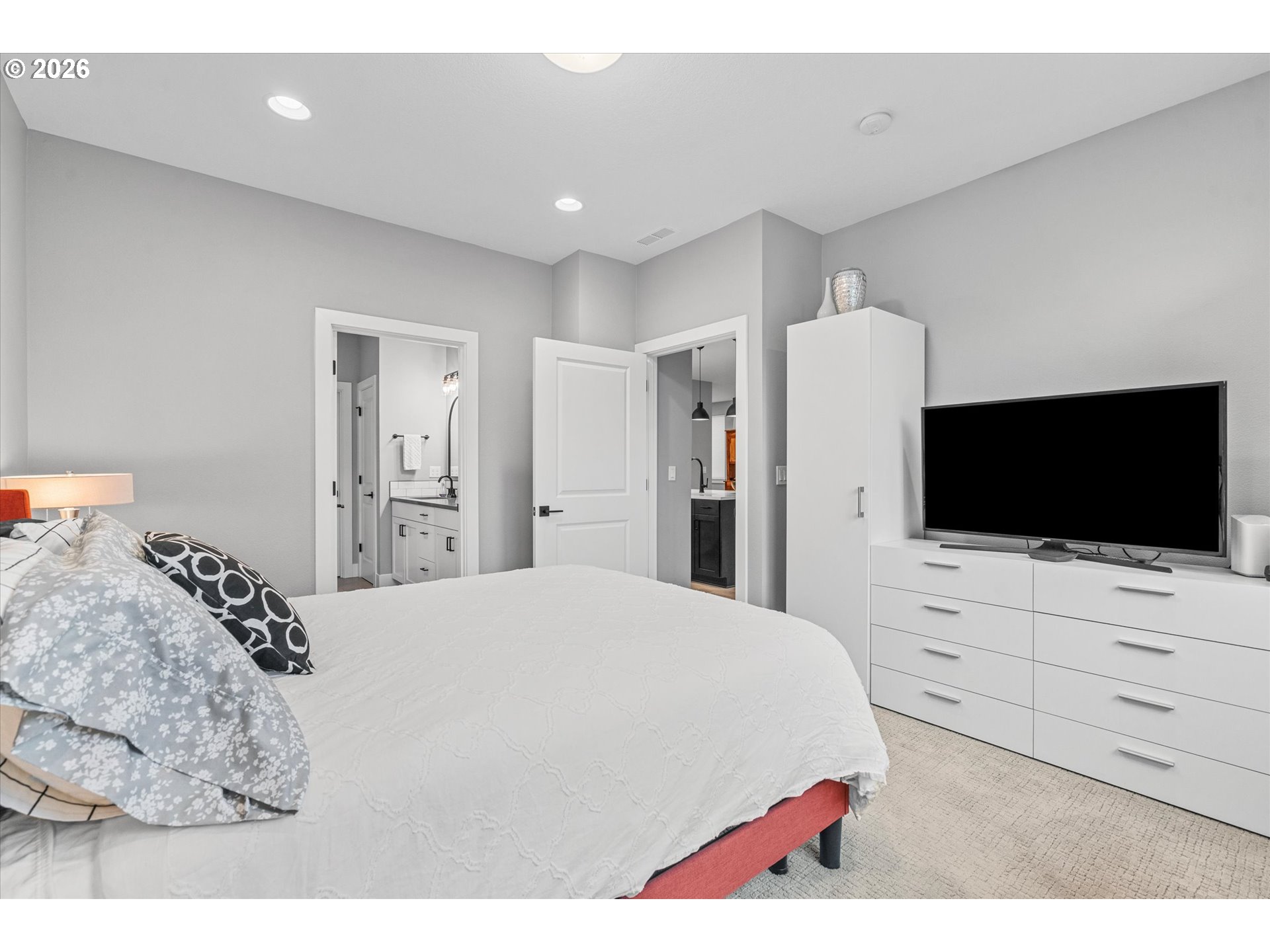 723 Southwest 49th Street Gresham, OR 97080 - Photo 21 of 48 a bedroom with a bed and a flat screen tv in it