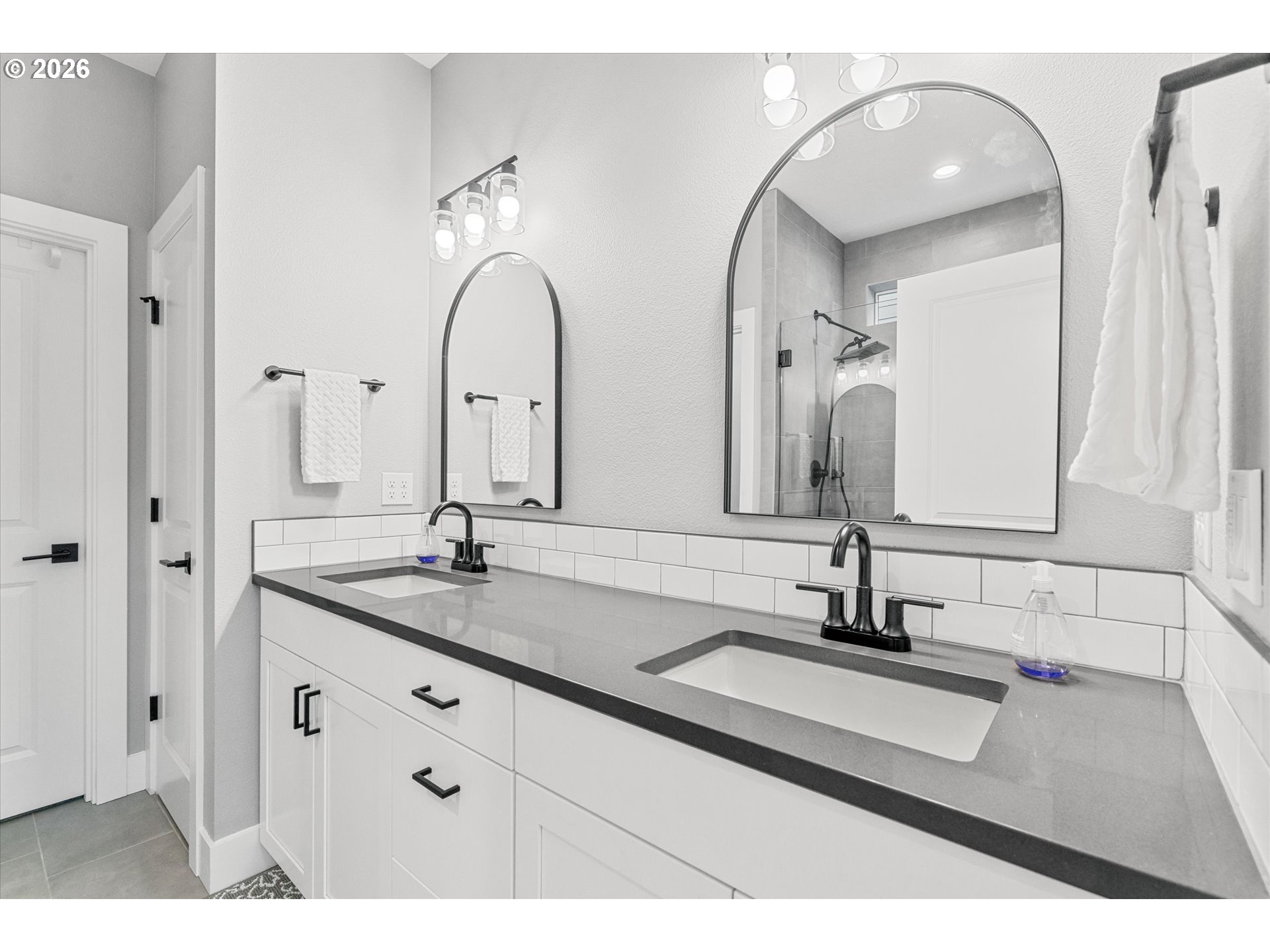 723 Southwest 49th Street Gresham, OR 97080 - Photo 22 of 48 a bathroom with double vanity sinks and a mirror