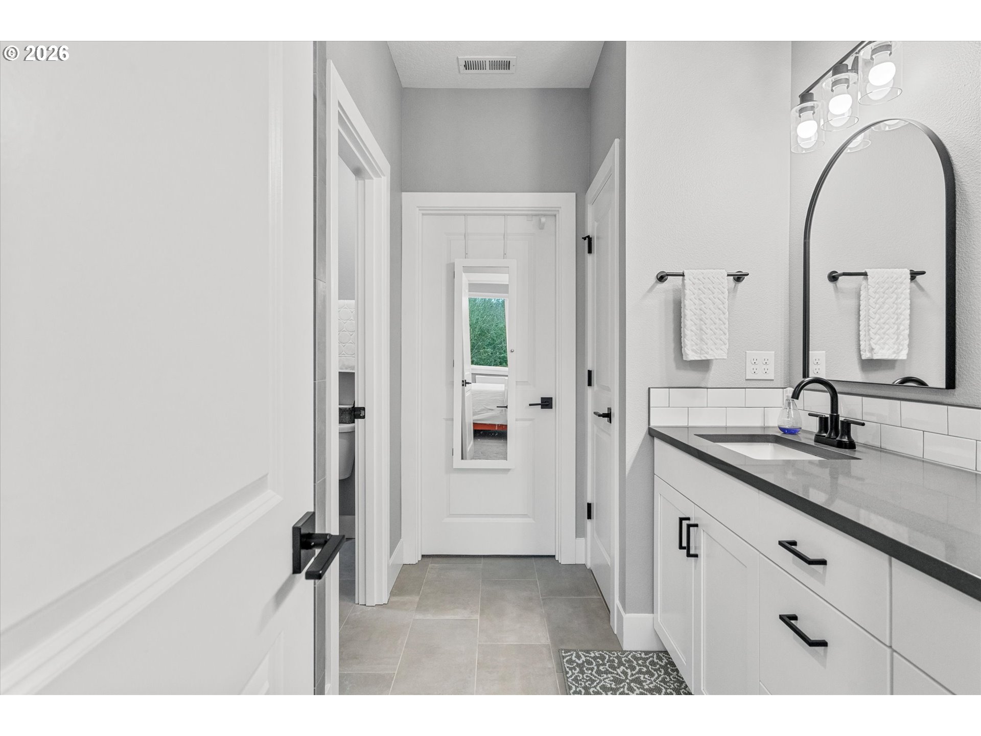 723 Southwest 49th Street Gresham, OR 97080 - Photo 23 of 48 a bathroom with a double vanity sink and a mirror