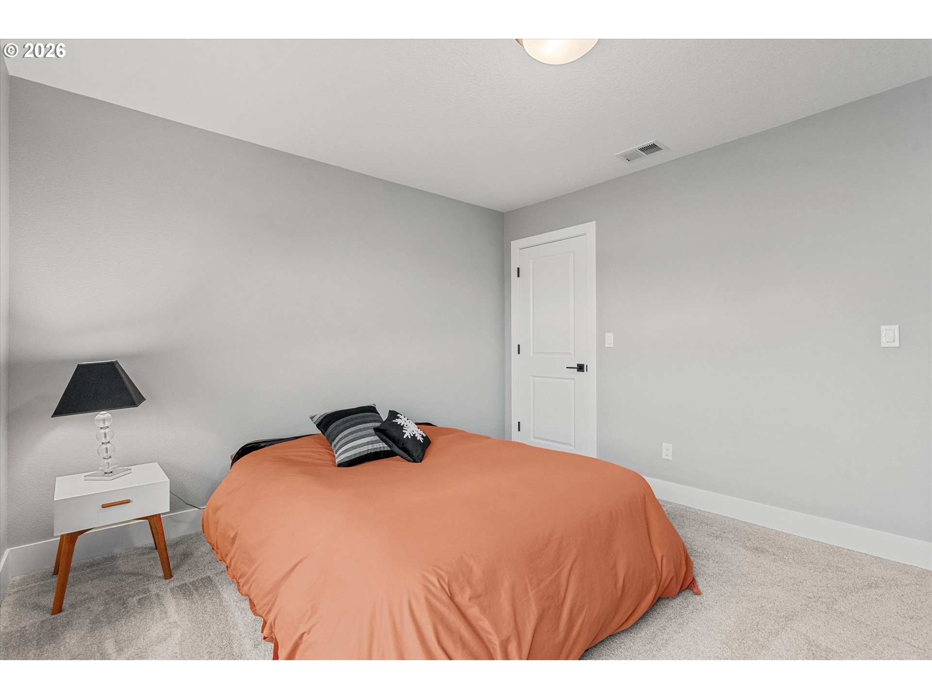 723 Southwest 49th Street Gresham, OR 97080 - Photo 27 of 48 a bedroom with a bed and a chair