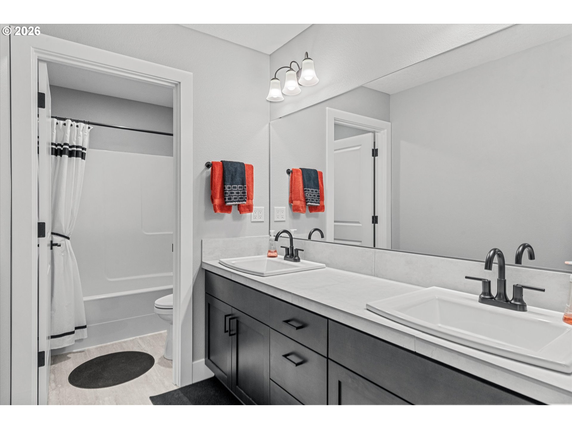723 Southwest 49th Street Gresham, OR 97080 - Photo 29 of 48 a bathroom with a sink and a mirror