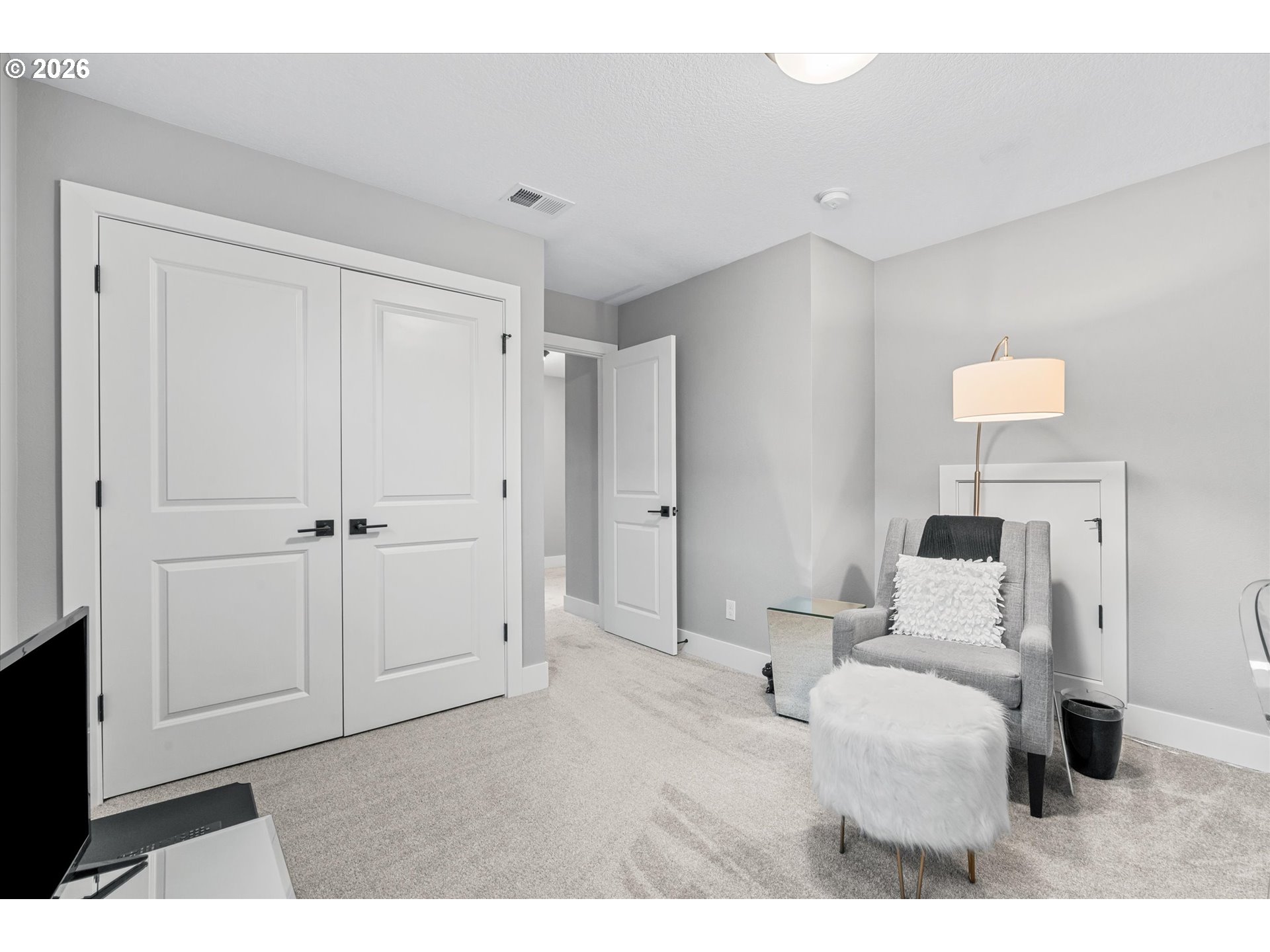 723 Southwest 49th Street Gresham, OR 97080 - Photo 31 of 48 a bedroom with a bed and a night stand