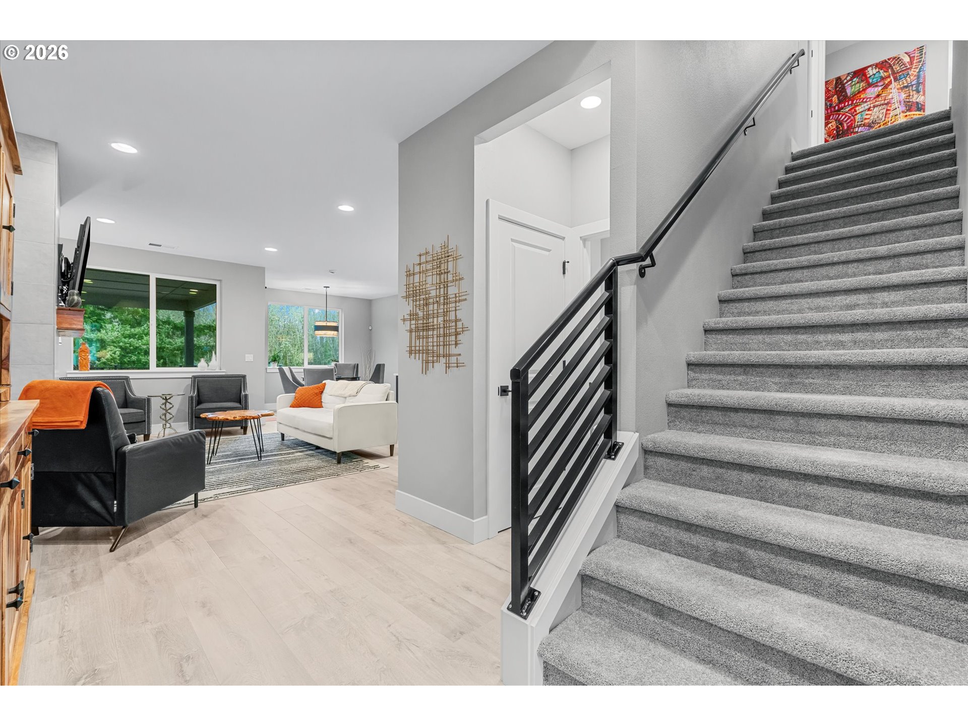 723 Southwest 49th Street Gresham, OR 97080 - Photo 4 of 48 a living room with furniture and stairs