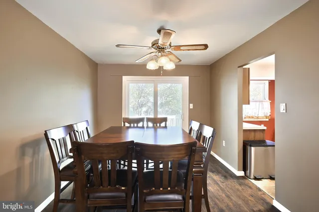 a kitchen that has a sink a stove and a table