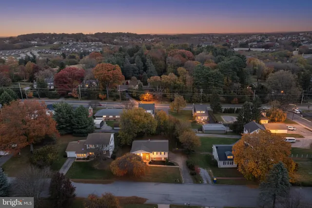 an aerial view of a town with swimming pool