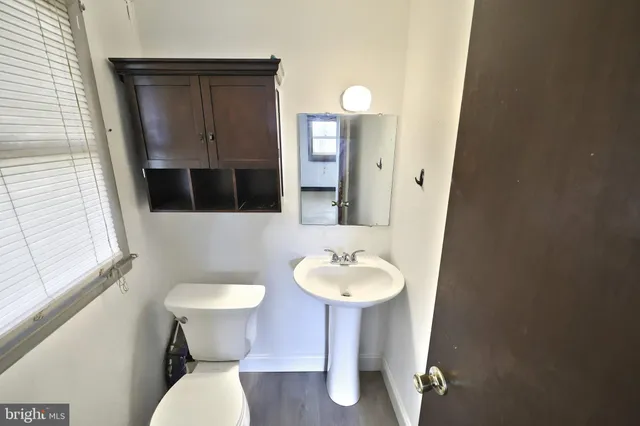 a view of an empty room with closet